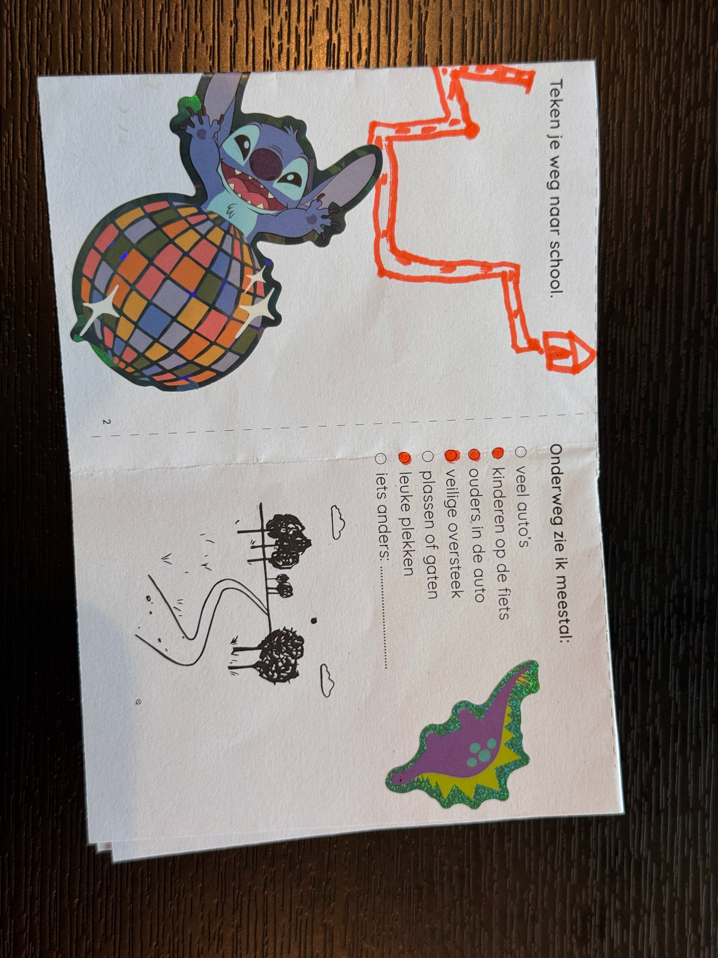 Inside spread with a hand-drawn route and disco ball sticker
