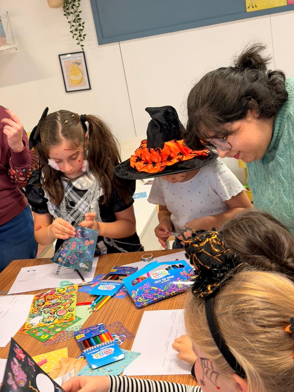 Making session with children at a Halloween-themed workshop