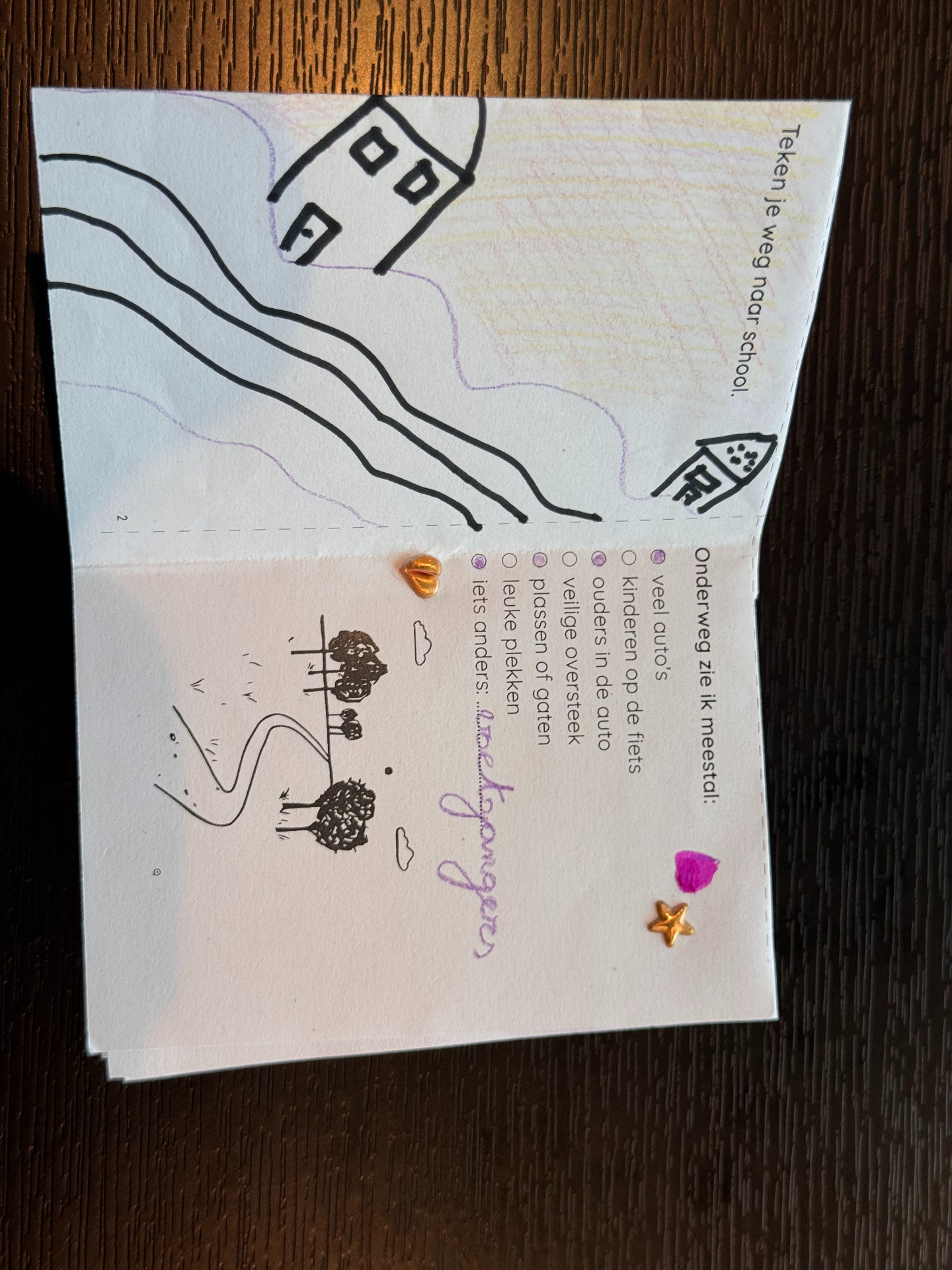 Inside spread with a house, winding road and stickers