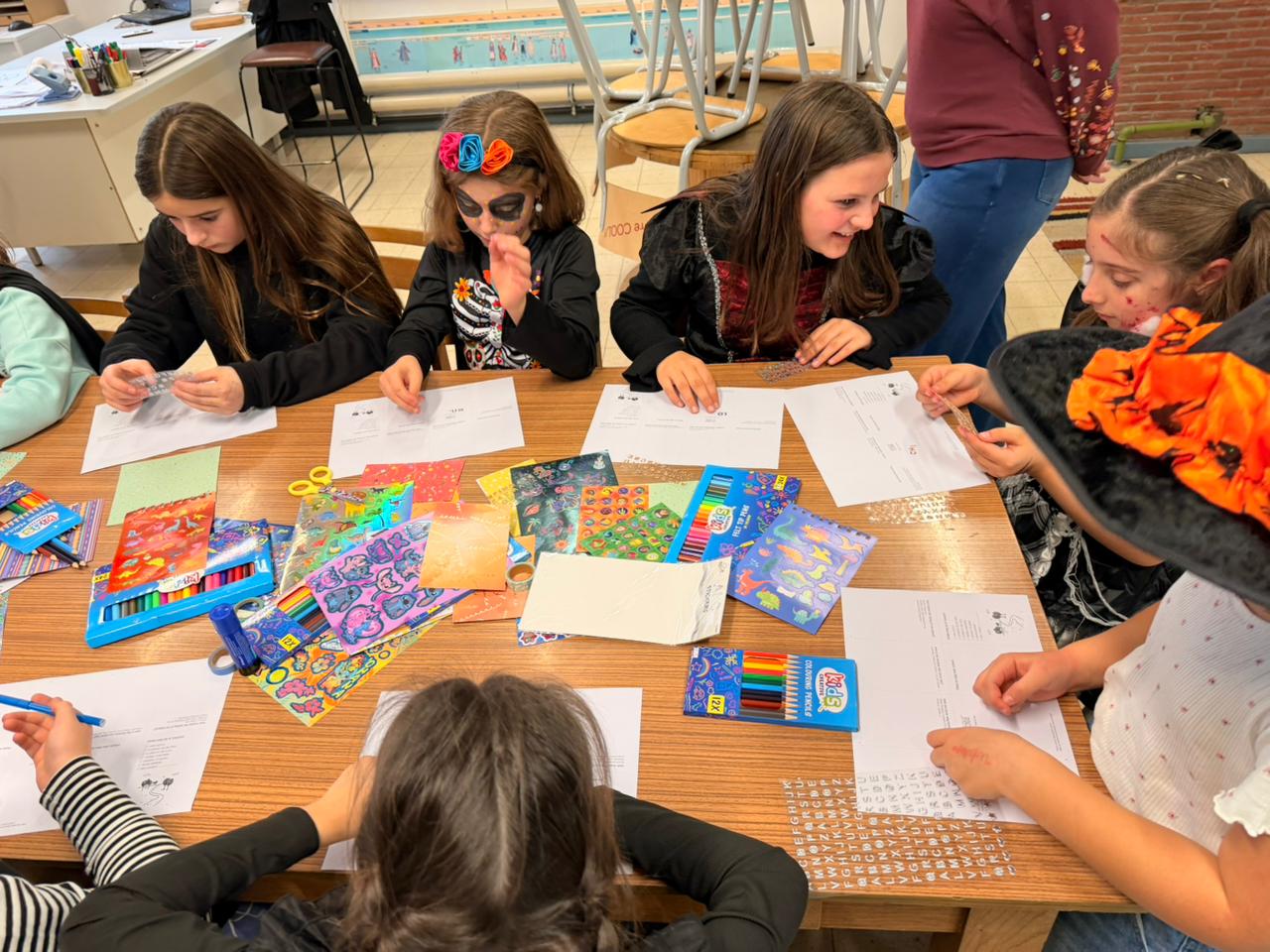 Children at a co-creation workshop decorating their travel route worksheets