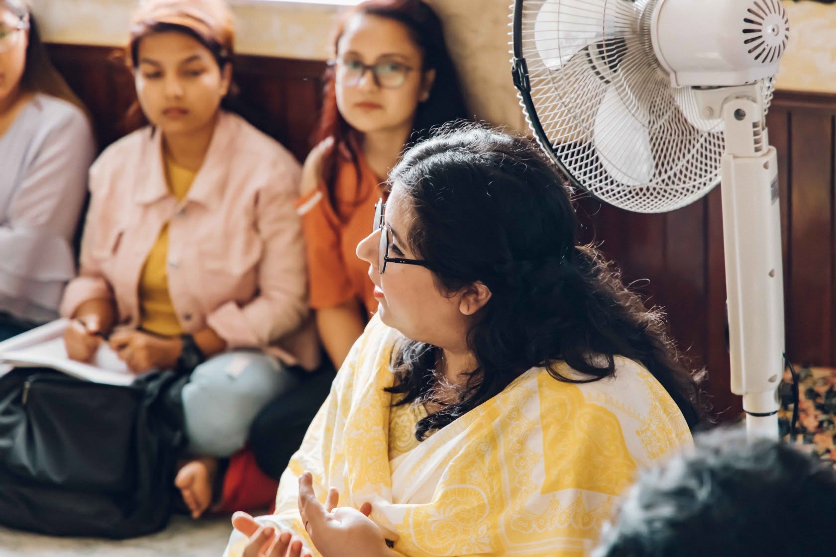 Tehreem speaking with participants during the workshop